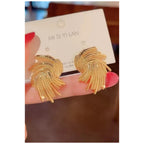 Stainless steel earrings , trending design Colour:- GoldAnti tarnish and Anti allergic 18 k gold plating Superior quality jewellery