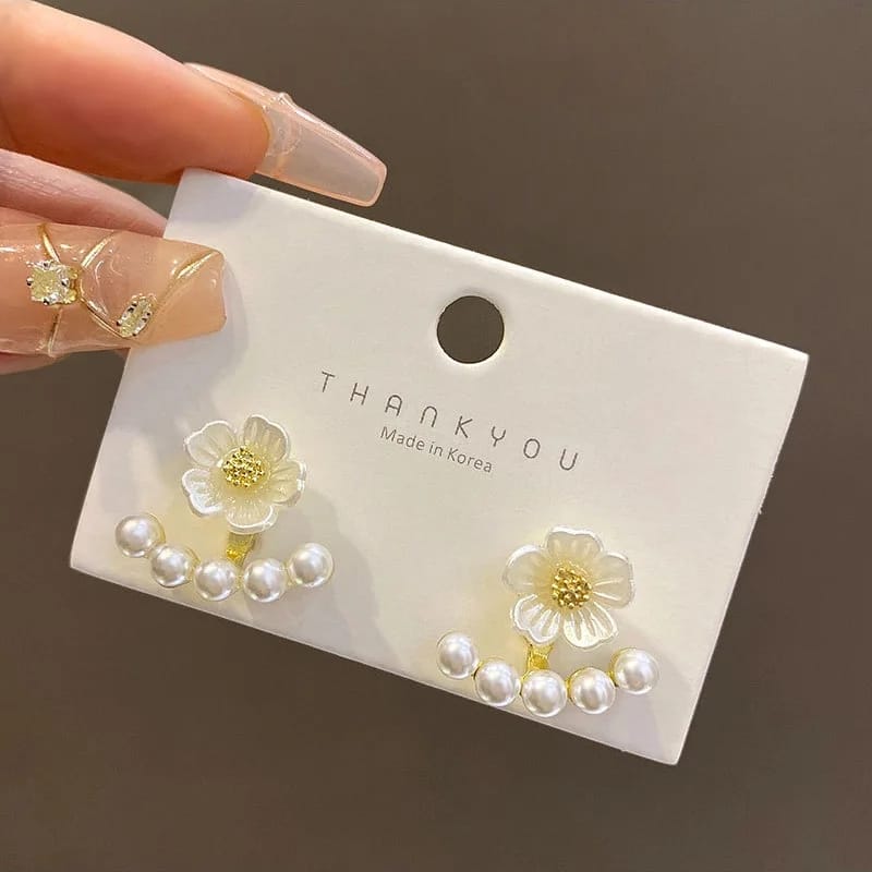 Pearl And Flower earringsExclusive launch designAnti tarnish materialMaterial:- Pearl  + Acrylic+ Alloy