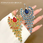 Peacock shape brooch Unisex style Material:- Alloy copper+ Rhinestones Colour:- Green, Red , Blue Anti tarnish and Anti Allergic Superior Quality products