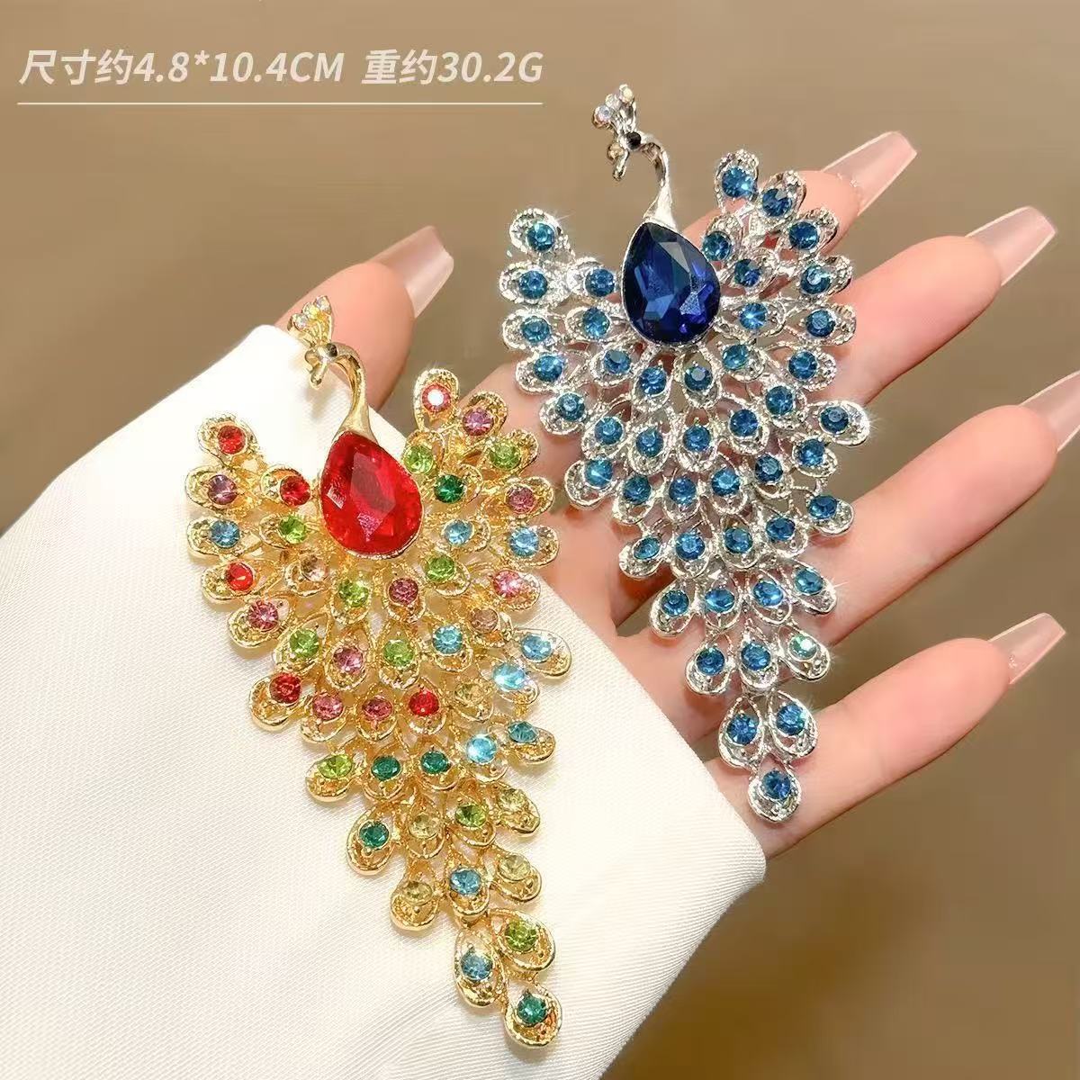 Peacock shape brooch Unisex style Material:- Alloy copper+ Rhinestones Colour:- Green, Red , Blue Anti tarnish and Anti Allergic Superior Quality products