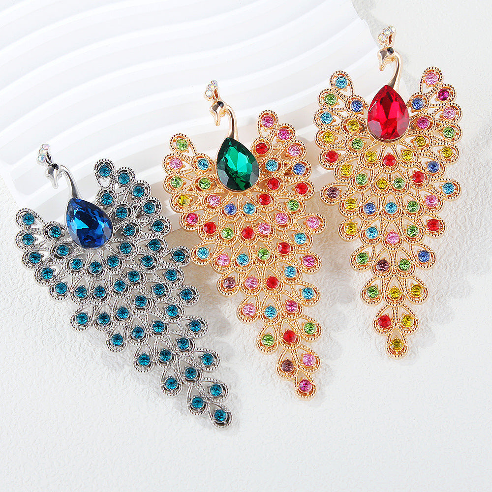 Peacock shape brooch Unisex style Material:- Alloy copper+ Rhinestones Colour:- Green, Red , Blue Anti tarnish and Anti Allergic Superior Quality products
