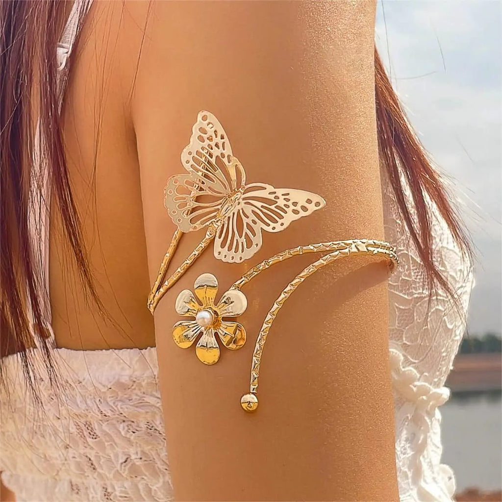 Butterfly/ Flower shaped Armlets Colour:- Gold Material:- Copper Alloy Anti tarnish and Anti Allergic Superior Quality products