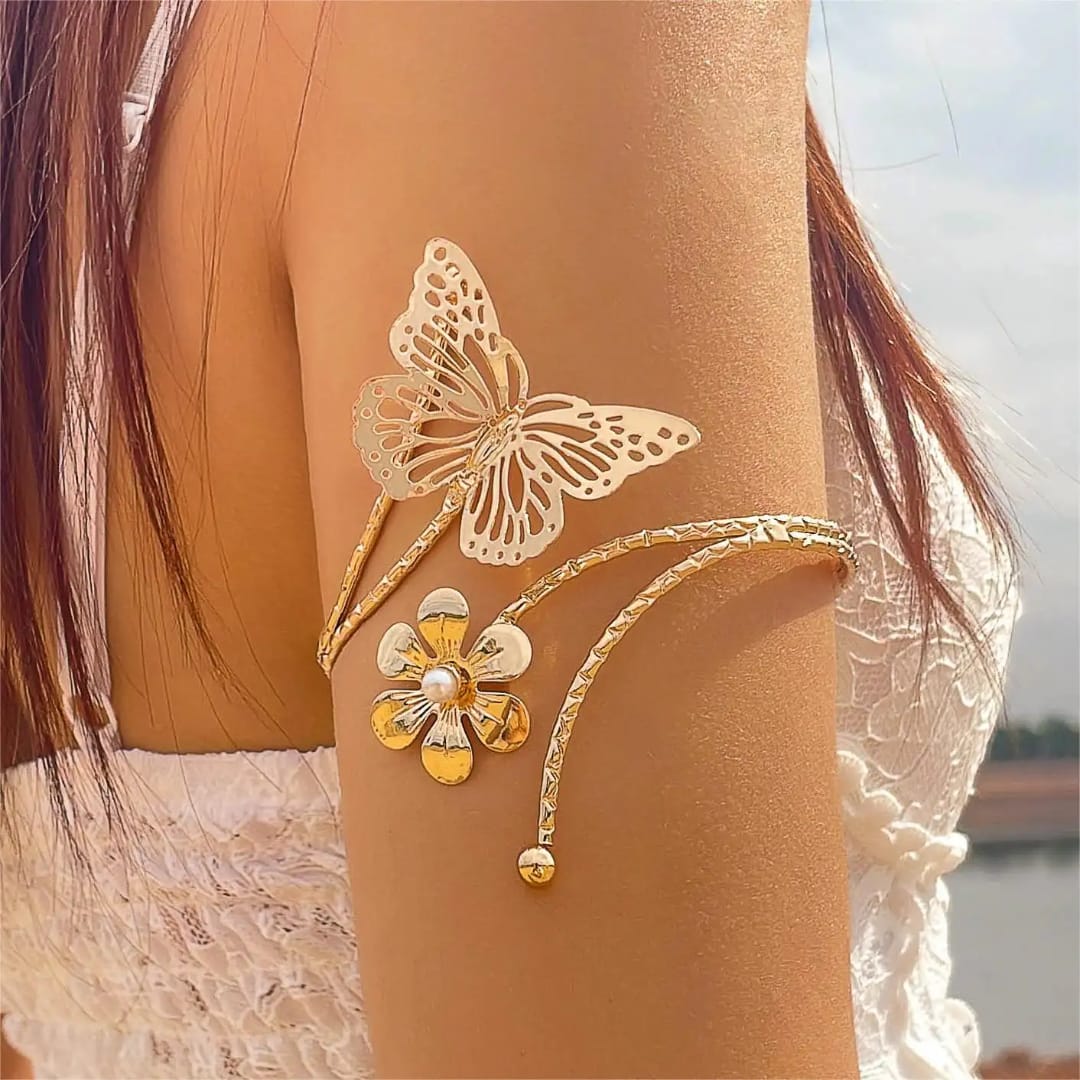 Butterfly/ Flower shaped Armlets Colour:- Gold Material:- Copper Alloy Anti tarnish and Anti Allergic Superior Quality products