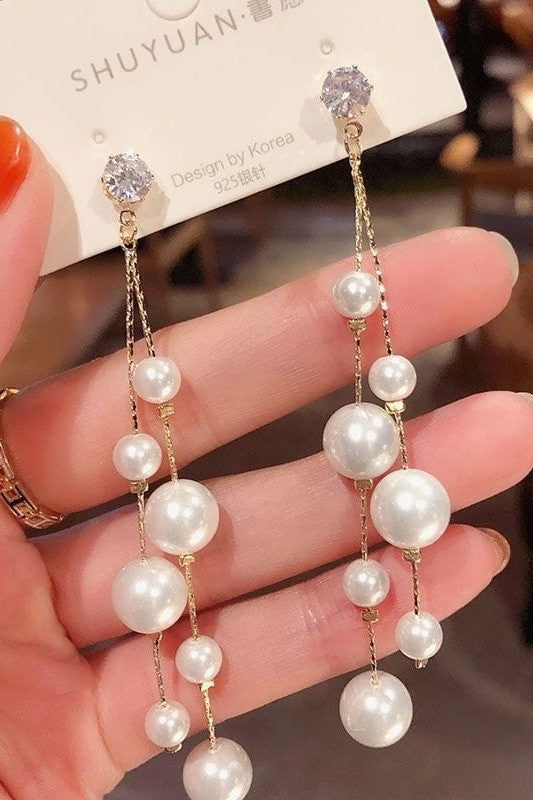 Long tassel pearl stone EarringsMaterial:- Alloy+ Pearls + StonesColor:- Gold