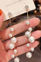 Long tassel pearl stone EarringsMaterial:- Alloy+ Pearls + StonesColor:- Gold