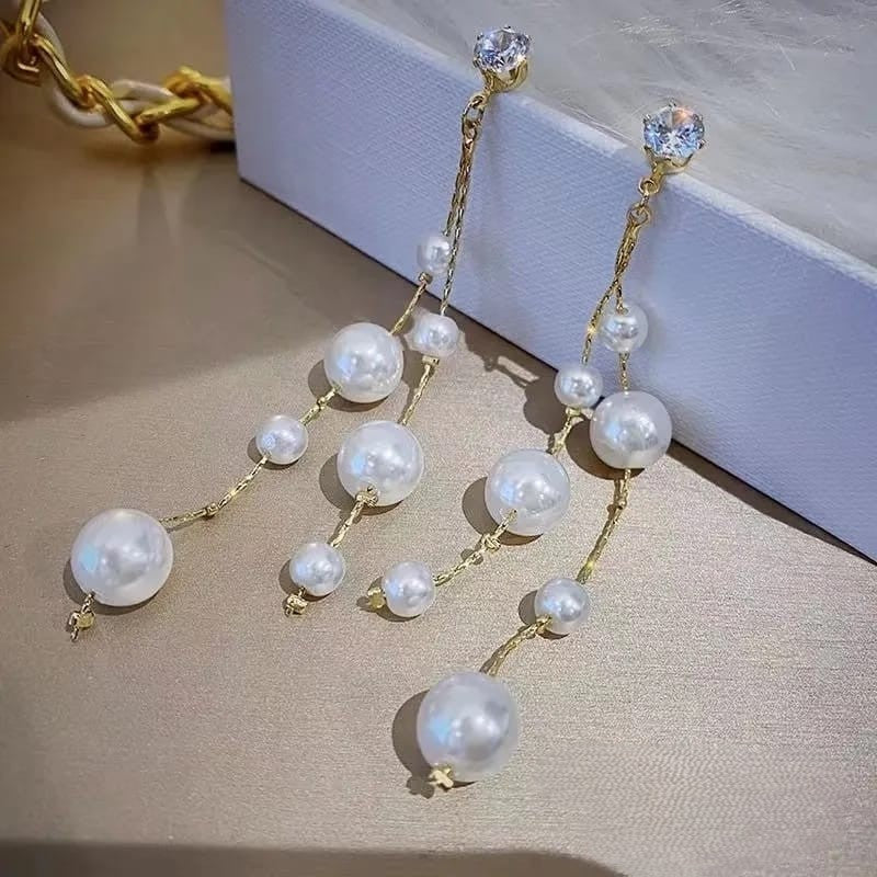 Long tassel pearl stone EarringsMaterial:- Alloy+ Pearls + StonesColor:- Gold
