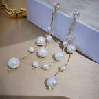 Long tassel pearl stone EarringsMaterial:- Alloy+ Pearls + StonesColor:- Gold