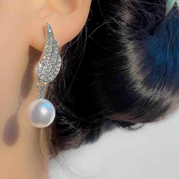 Angel Wings Earrings with pearl Material:- Alloy Copper+ Stones + Silver plating Colour:- Silver