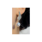 Angel Wings Earrings with pearl Material:- Alloy Copper+ Stones + Silver plating Colour:- Silver