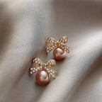 Women's Bow and Pearl Combination Ear studsMaterial:- Pearl + AlloyColor:- Gold