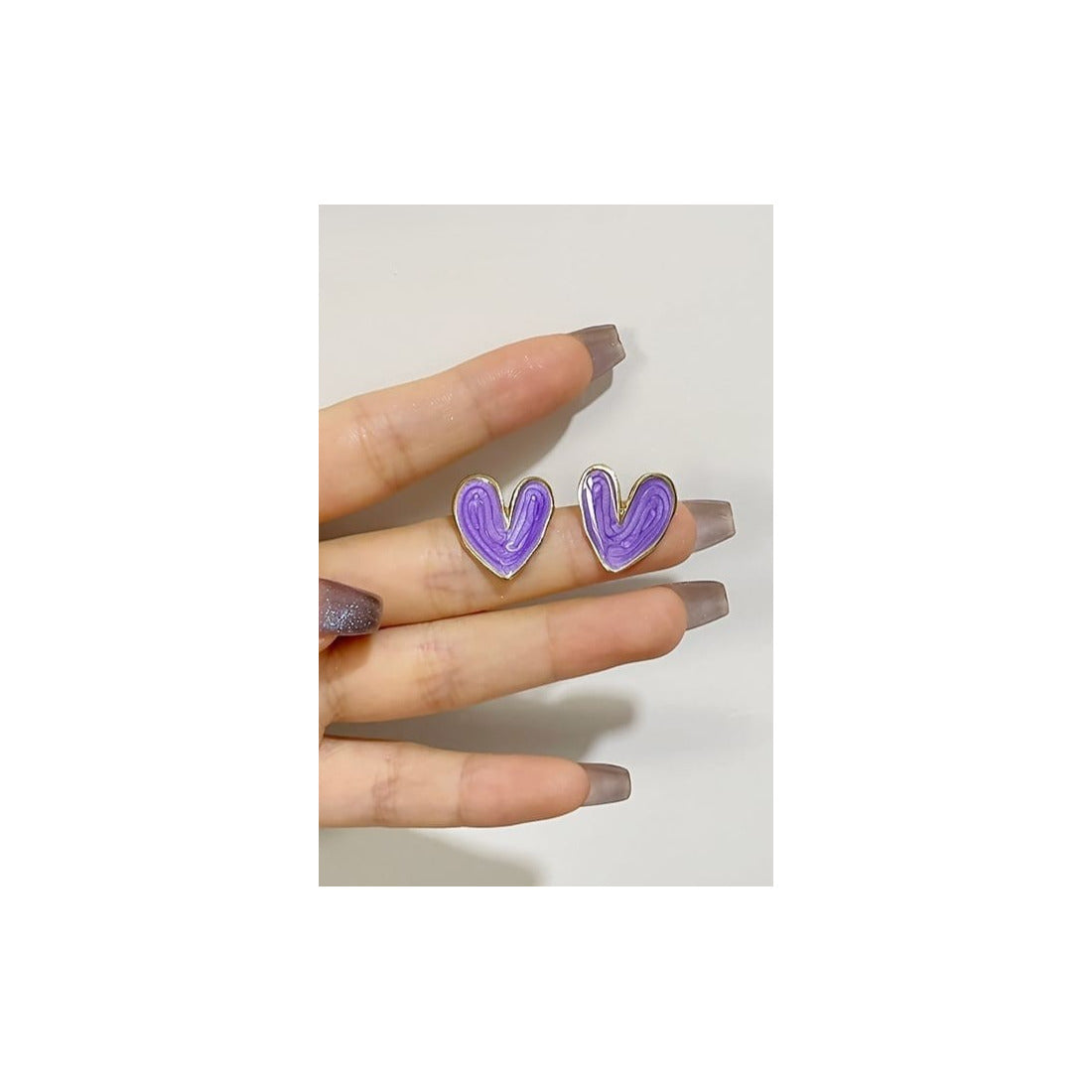 Heart shape Studs for womenAnti tarnish materialColour:- Blue and purpleMaterial:- Alloy Zinc
