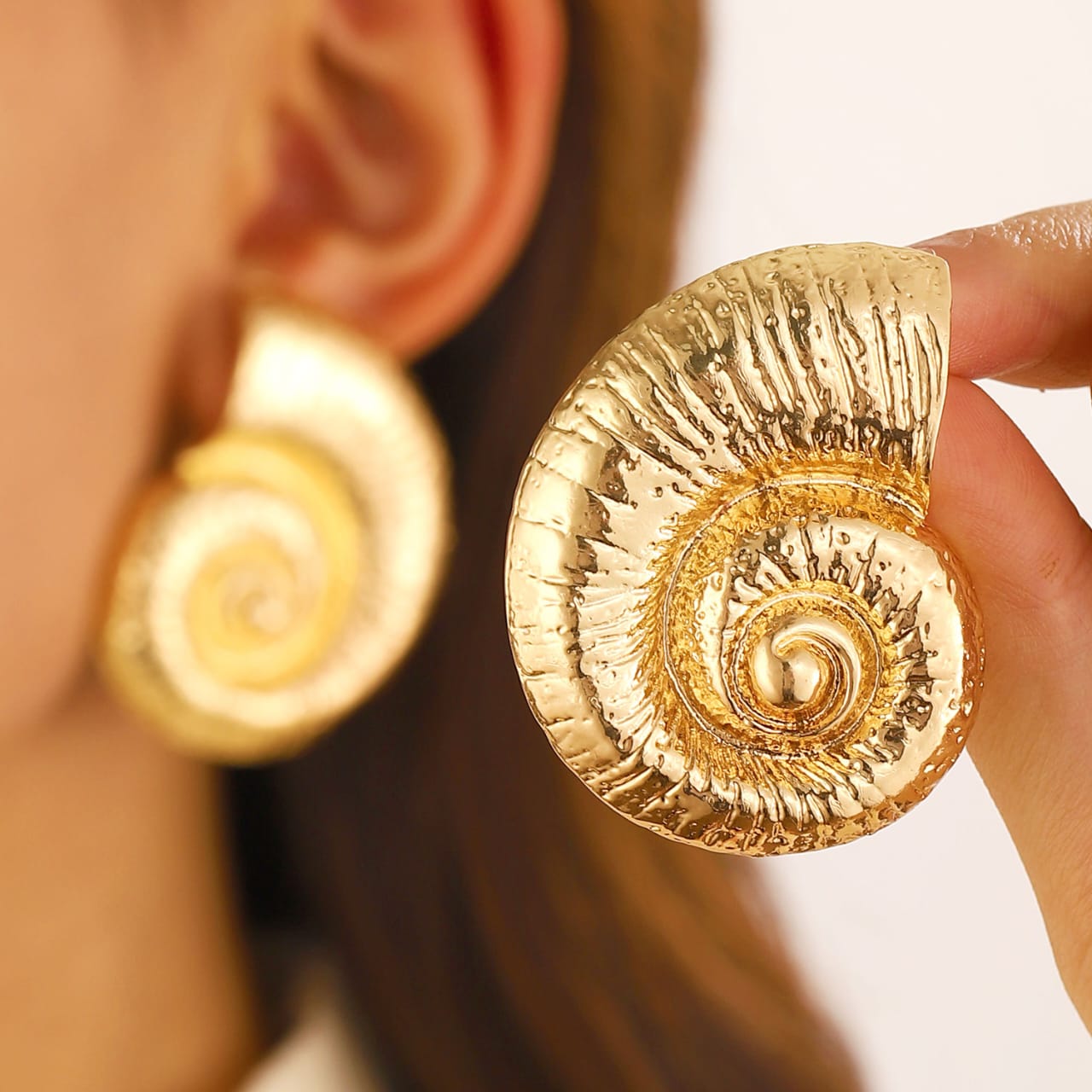 Snail shape oversized Earrings for women Material:- Copper and Gold Electroplating Size :- 4.3 cm Anti Tarnish earrings