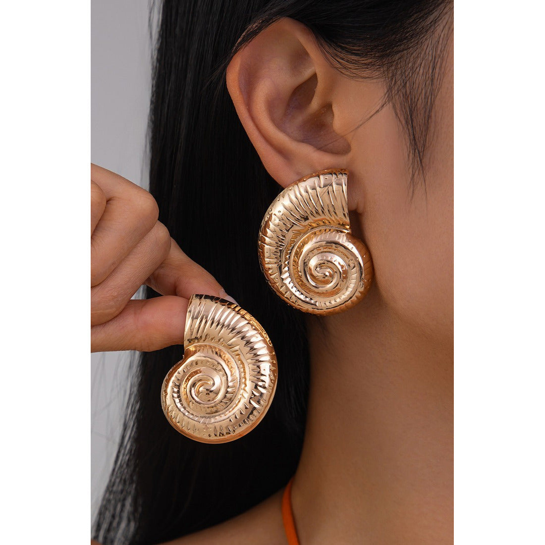 Snail shape oversized Earrings for women Material:- Copper and Gold Electroplating Size :- 4.3 cm Anti Tarnish earrings