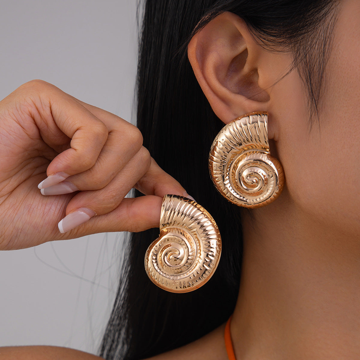 Snail shape oversized Earrings for women Material:- Copper and Gold Electroplating Size :- 4.3 cm Anti Tarnish earrings