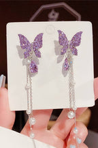 Butterfly hanging earrings Colour:- Purple Material:- Pearl and Copper