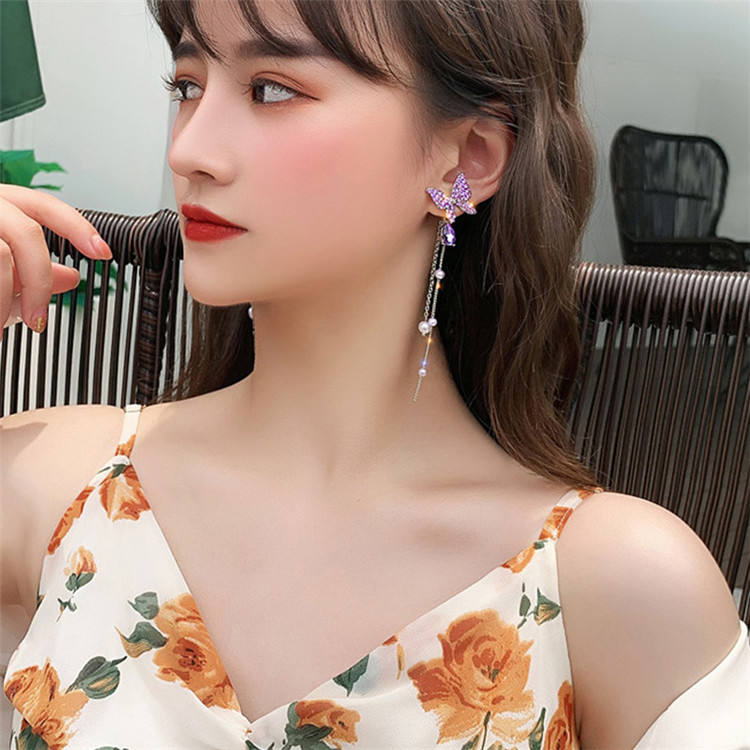 Butterfly hanging earrings Colour:- Purple Material:- Pearl and Copper