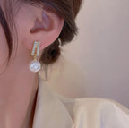 Pearl earrings for women Color :- Same as photo Material:- Alloy copper