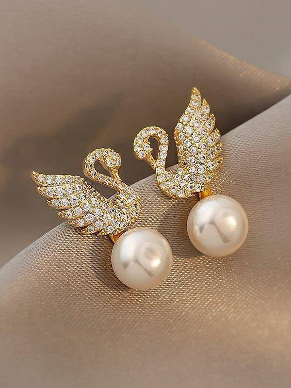 Swan stud earrings for womenMaterial:- Alloy zinc, pearl and zirconColor :- Gold
