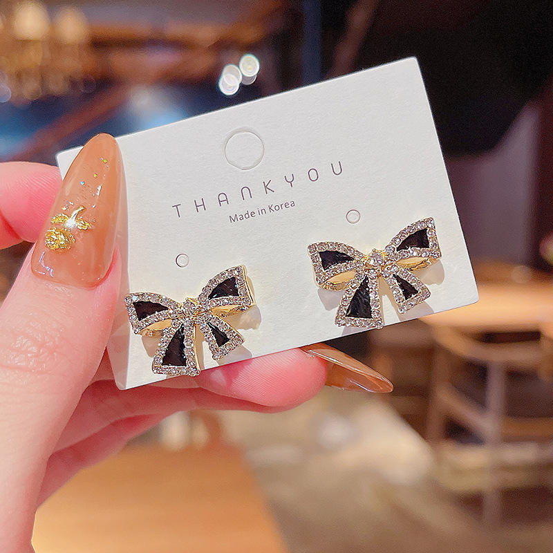 Bow shaped ear studs for women