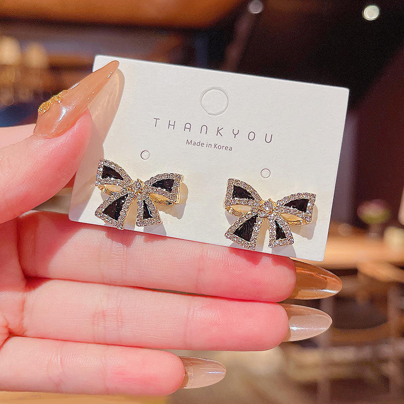 Bow shaped ear studs for women