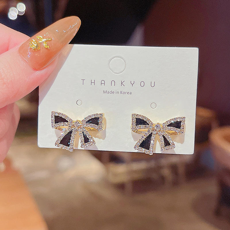 Bow shaped ear studs for women