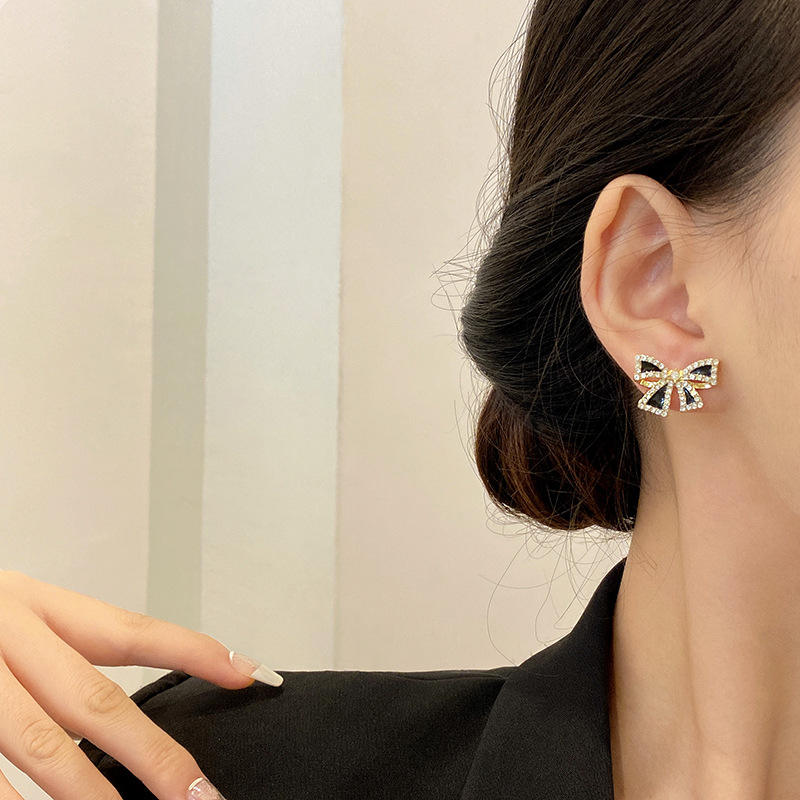 Bow shaped ear studs for women