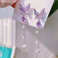 Butterfly hanging earrings Colour:- Purple Material:- Pearl and Copper