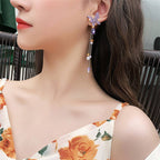 Butterfly hanging earrings Colour:- Purple Material:- Pearl and Copper