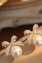 Women's Bow and Pearl Combination Ear studsMaterial:- Pearl + AlloyColor:- Gold