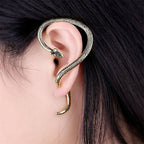 Snake ear studs Colour:- Black and goldMaterial:- Alloy plated