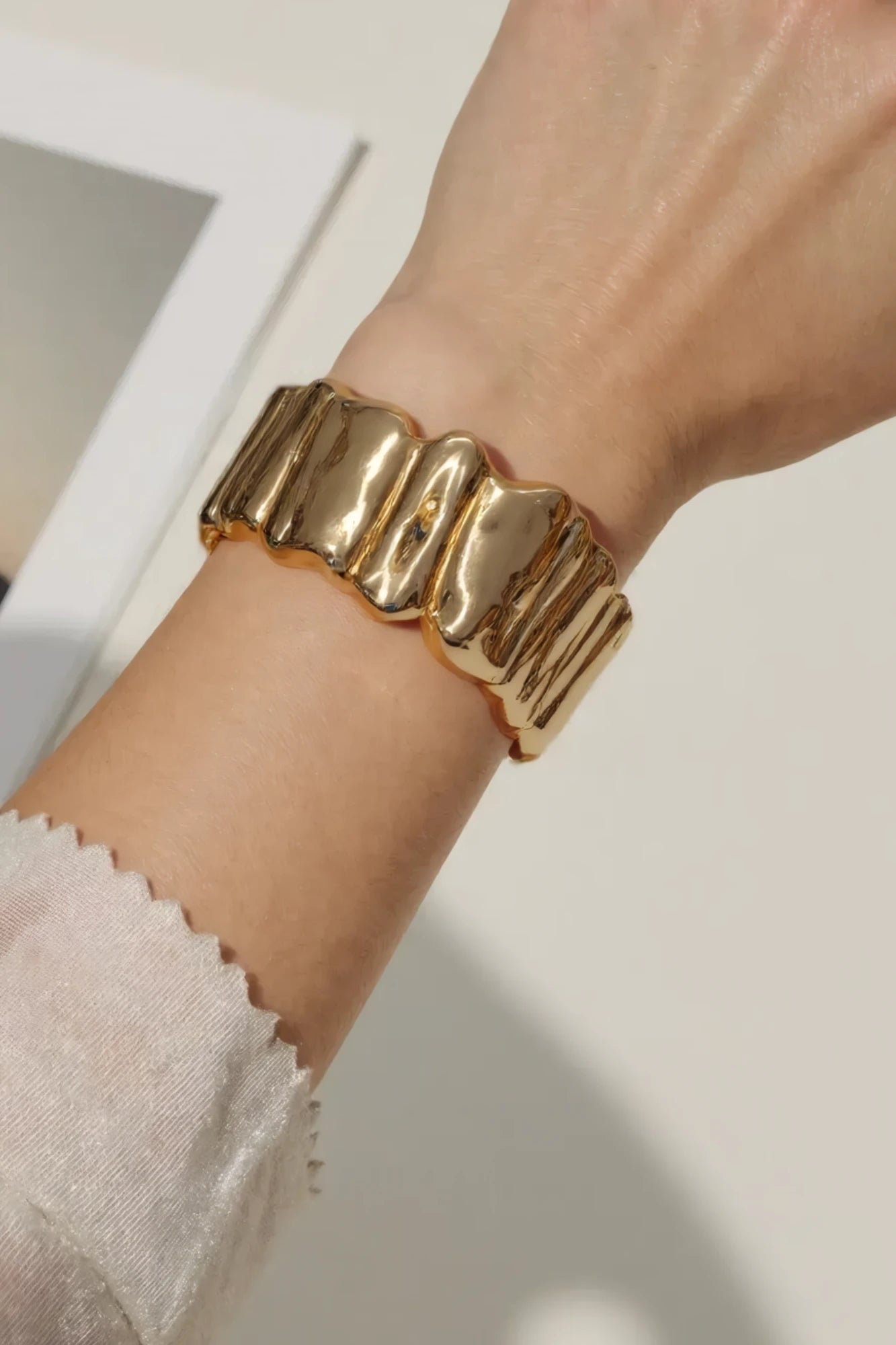 OMID Golden Tone Waves Shaped Brass Bracelet