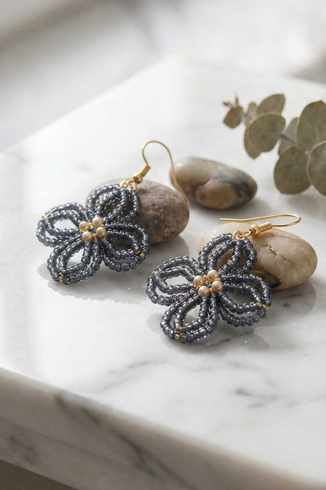 Gray Beaded Four-Petal Flower Drop Earrings with Pearl Center and Gold Hooks.