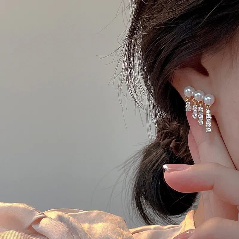 Women pearl Rhinestones tassel EarringsMaterial:- Pearl + Stones + AlloyColour:- Gold