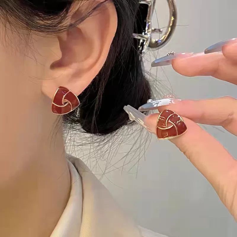 Anti tarnish triangle shape Ear StudsMaterial :- Alloy ZincColor :- Same as photo