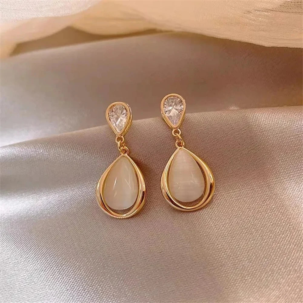 Pearl drop earrings for womenMaterial:- Pearl + Stones + AlloyColor:- Gold
