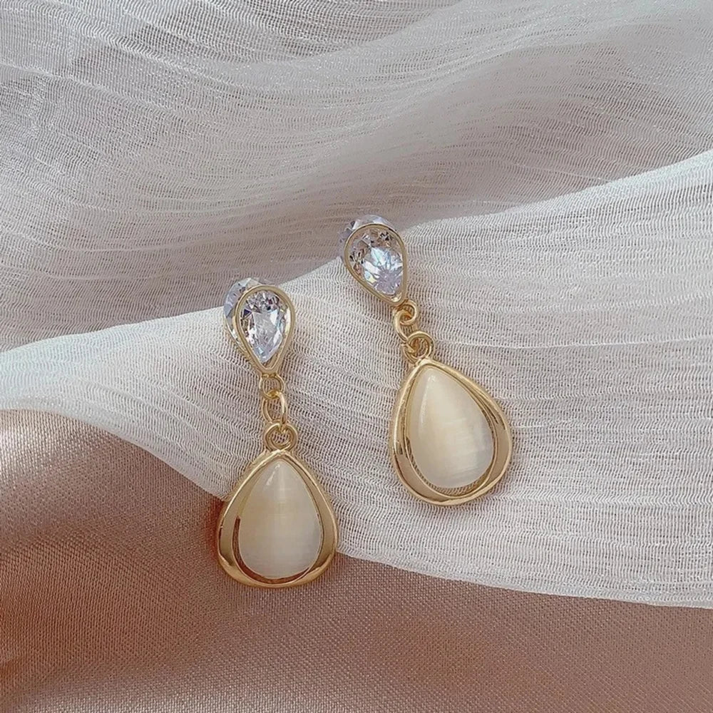Pearl drop earrings for womenMaterial:- Pearl + Stones + AlloyColor:- Gold