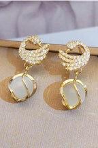 Swan Shape Fashionable earrings Color :- Gold Material  :- Stones and Zircon Alloy