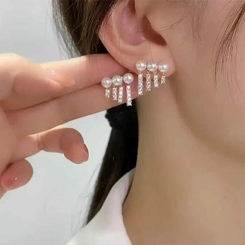 Women pearl Rhinestones tassel EarringsMaterial:- Pearl + Stones + AlloyColour:- Gold
