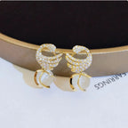 Swan Shape Fashionable earrings Color :- Gold Material  :- Stones and Zircon Alloy