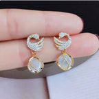 Swan Shape Fashionable earrings Color :- Gold Material  :- Stones and Zircon Alloy